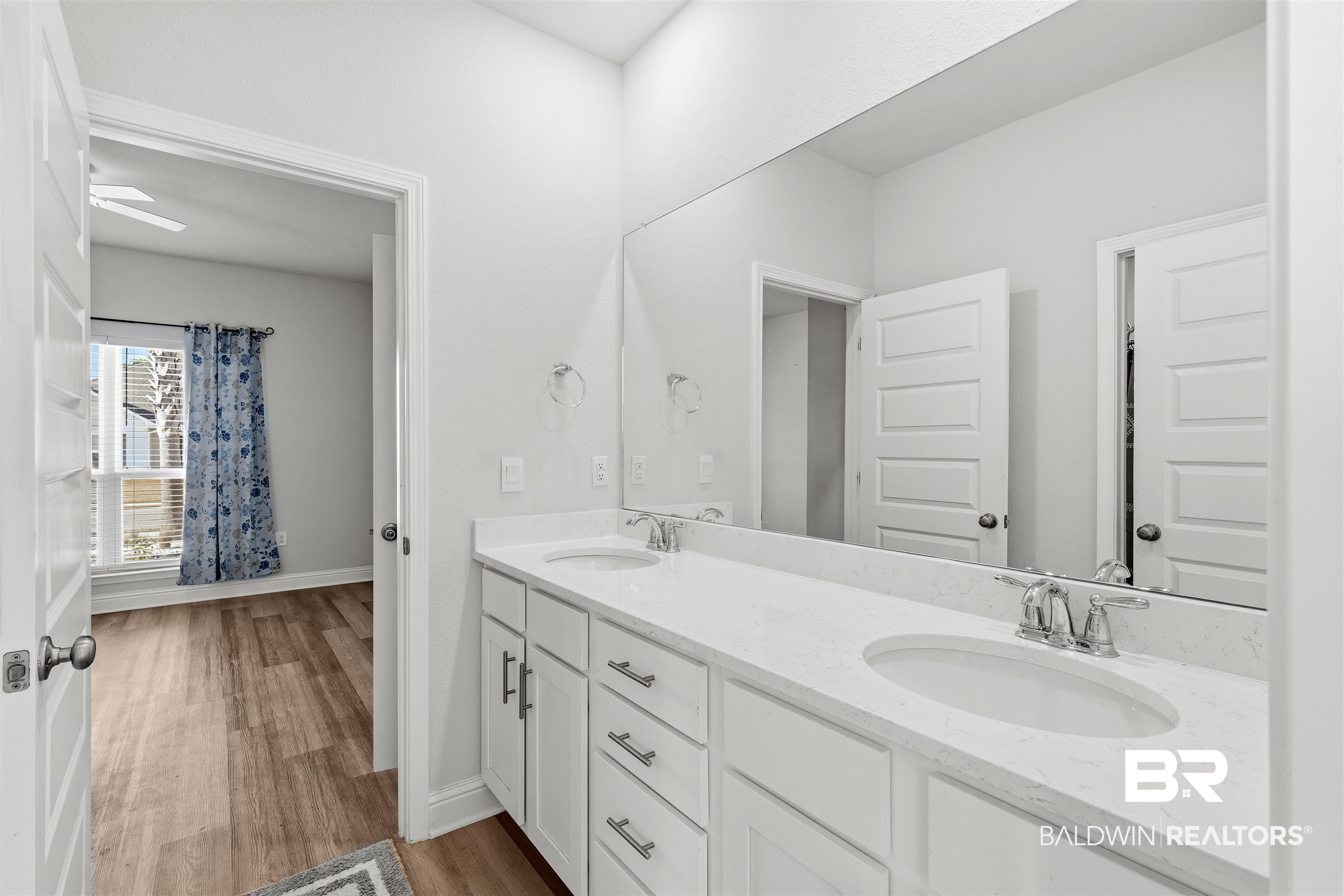 485 Shepard Street Gulf Shores, AL 36542 - Photo 35 of 53 Full bath with double vanity and dark wood-style floors