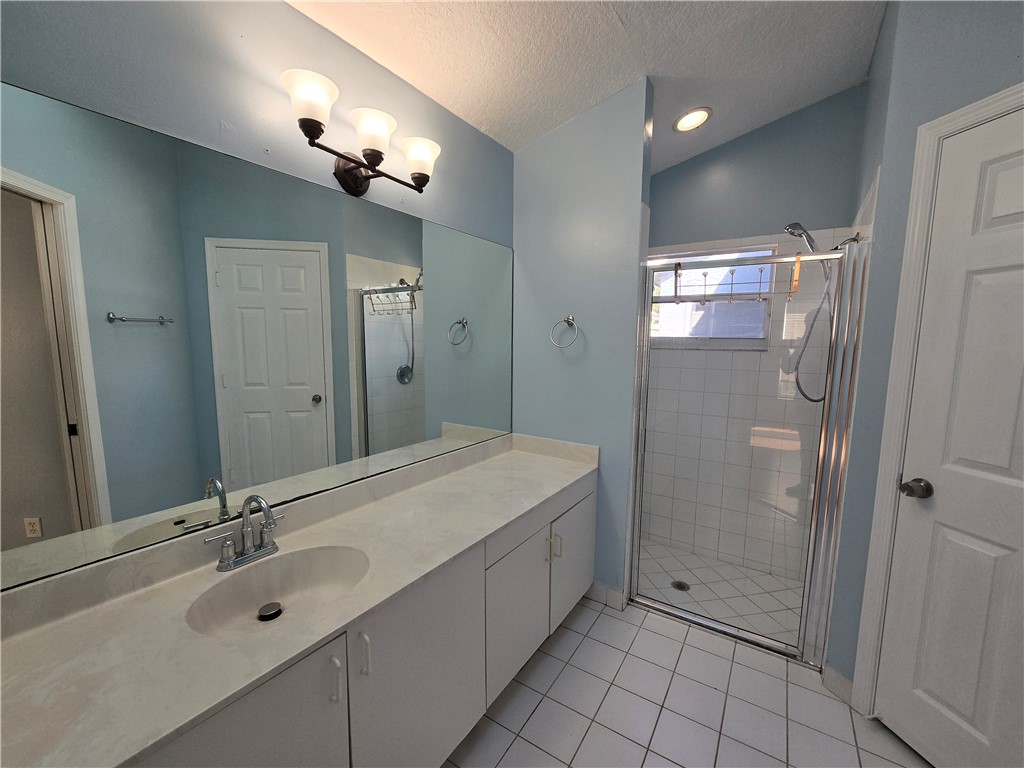 481 10th Place Vero Beach, FL 32960 - Photo 10 of 20 a spacious bathroom with a shower sink and mirror