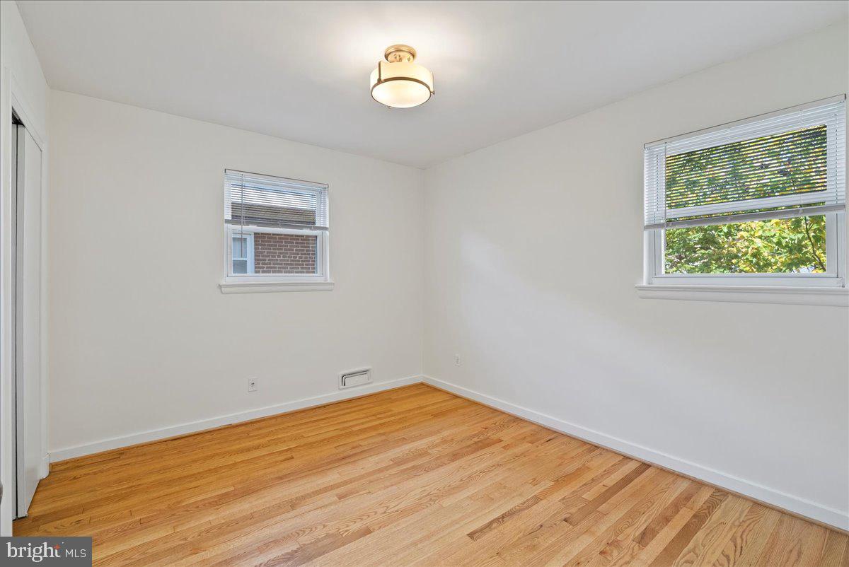 4411 Harrison Street Northwest Washington, DC 20015 - Photo 14 of 38 a view of empty room with wooden floor and fan