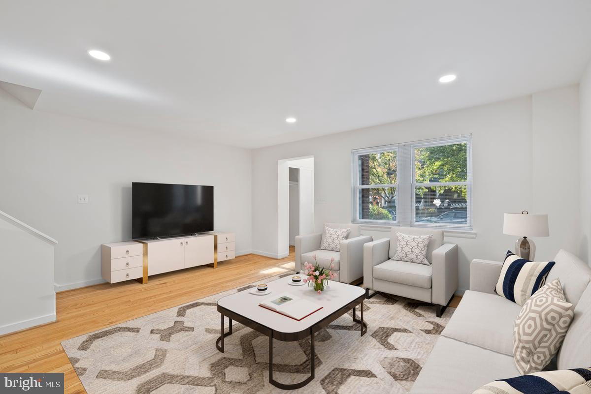 4411 Harrison Street Northwest Washington, DC 20015 - Photo 3 of 38 a living room with furniture and a flat screen tv
