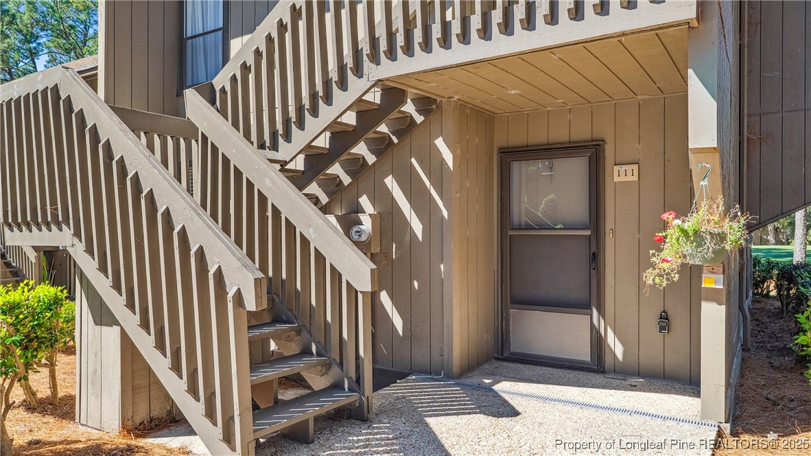 a view of entryway with wooden floor
