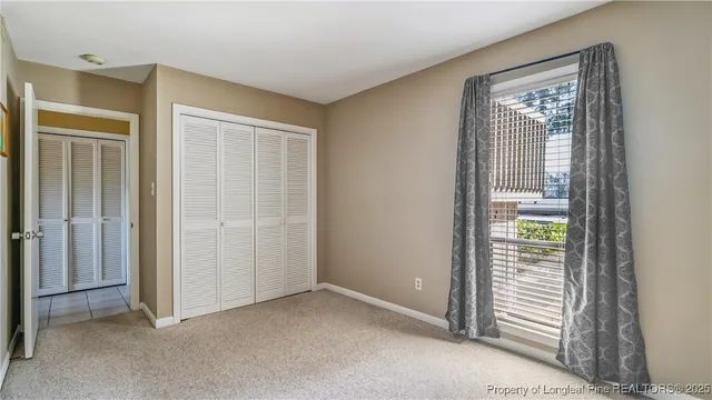 an empty room that has a window in it