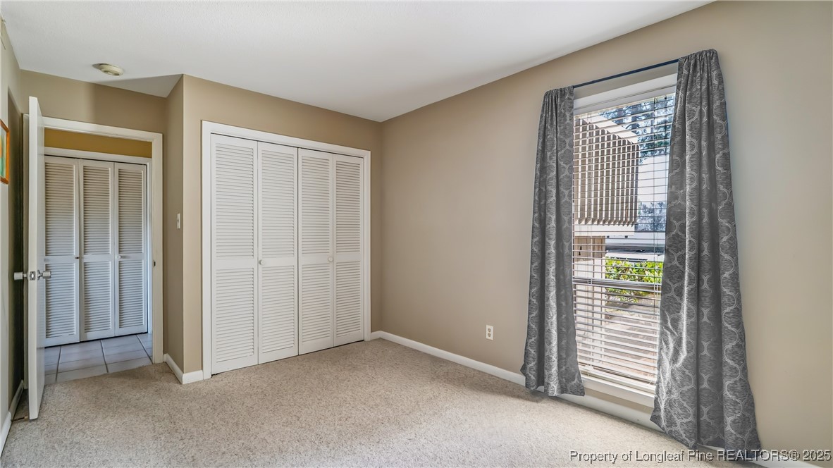 115 Beulah Hill Road South, Unit 111 Pinehurst, NC 28374 - Photo 15 of 32 an empty room that has a window in it