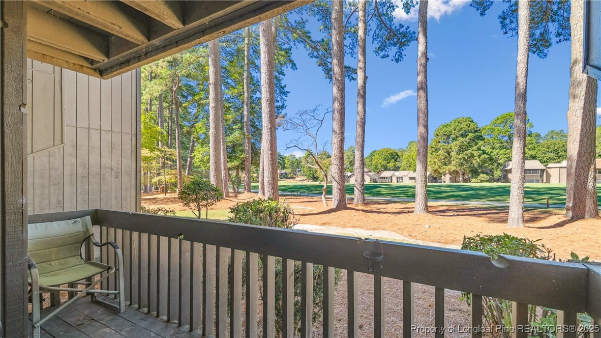 115 Beulah Hill Road South, Unit 111 Pinehurst, NC 28374 - Photo 17 of 32 a view of a garden with pathway