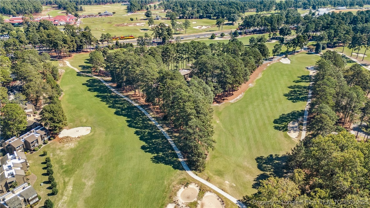 115 Beulah Hill Road South, Unit 111 Pinehurst, NC 28374 - Photo 25 of 32 a view of a lake with a city