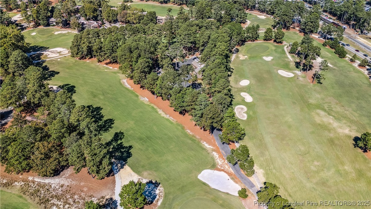 115 Beulah Hill Road South, Unit 111 Pinehurst, NC 28374 - Photo 26 of 32 an aerial view of lake residential house with outdoor space and trees around