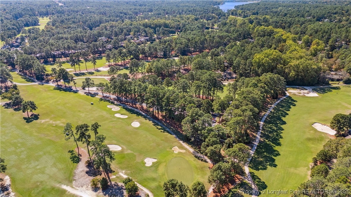115 Beulah Hill Road South, Unit 111 Pinehurst, NC 28374 - Photo 31 of 32 an aerial view of residential houses with outdoor space and swimming pool