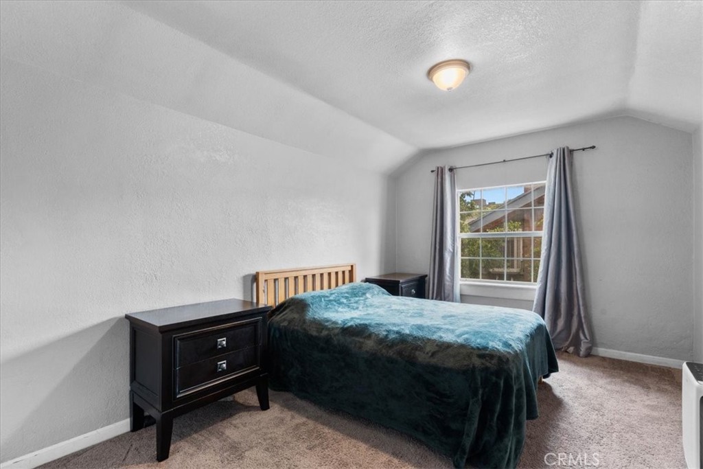 3974 5th Street Riverside, CA 92501 - Photo 24 of 45 a bedroom with a bed and a window