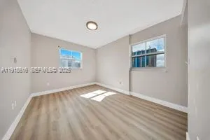 a view of an empty room and window