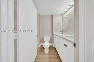 a spacious bathroom with a shower sink and toilet