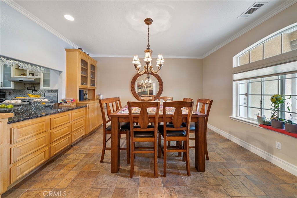 7172 Jargon Road Hesperia, CA 92344 - Photo 14 of 75 a view of a dining room with furniture window and outside view