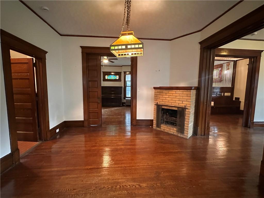 150 Euclid Avenue Sharon, PA 16146 - Photo 13 of 49 a view of a livingroom with wooden floor fireplace and window