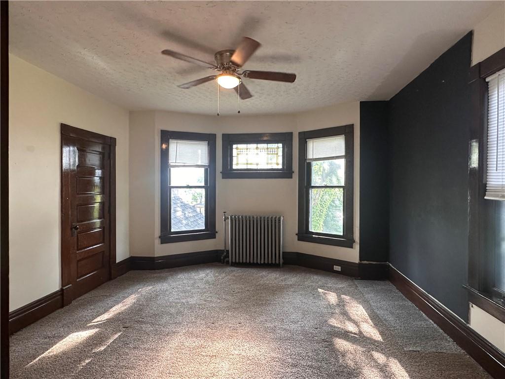150 Euclid Avenue Sharon, PA 16146 - Photo 23 of 49 a view of livingroom with window ceiling fan and windows