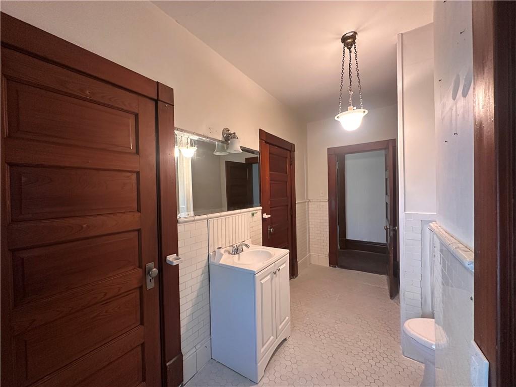 150 Euclid Avenue Sharon, PA 16146 - Photo 30 of 49 a bathroom with a sink and mirror