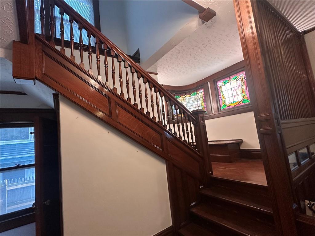 150 Euclid Avenue Sharon, PA 16146 - Photo 4 of 49 a view of staircase with lots of frames on wall and a window