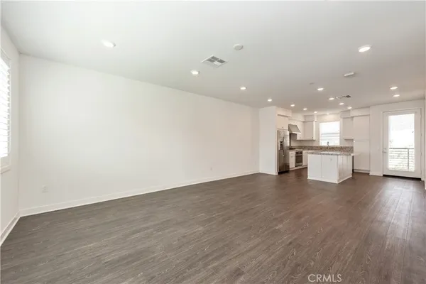 a view of kitchen with wooden floor
