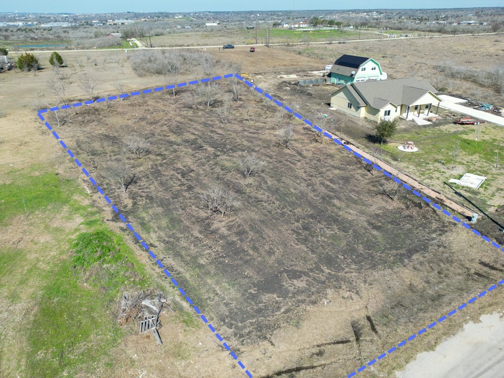 433 East Ridge Lane Kyle, TX 78640 - Photo 1 of 3 Aerial view of sparsely populated area featuring property parcel outlined