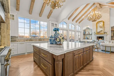 a kitchen with stainless steel appliances granite countertop a sink and cabinets