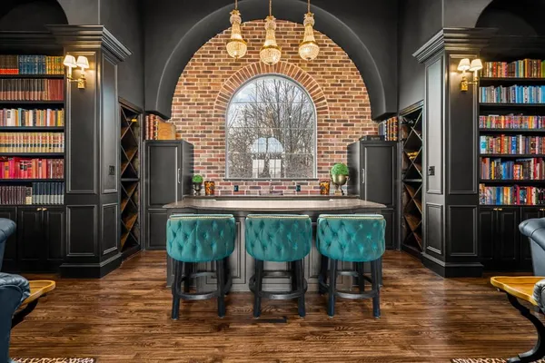 a kitchen with stainless steel appliances granite countertop sink stove and cabinets