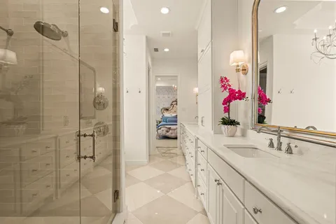 a bathroom with a sink vanity and a mirror