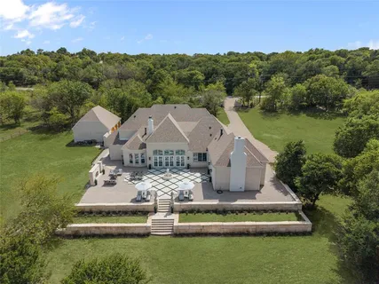 an aerial view of a house with a garden