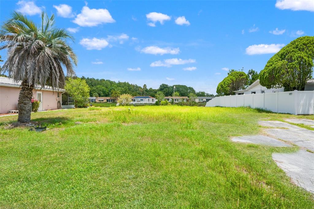7211 Ashwood Drive Port Richey, FL 34668 - Photo 6 of 12 a view of a swimming pool and lake view