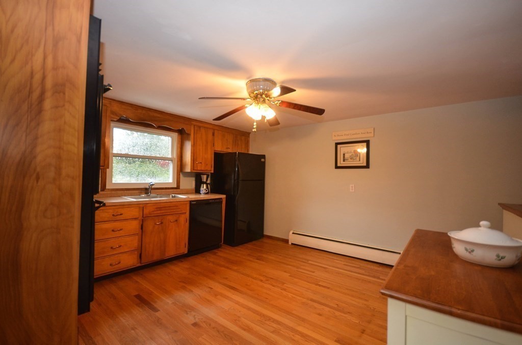41 Mason Road Dudley, MA 01571 - Photo 8 of 21 a kitchen with a refrigerator and a sink