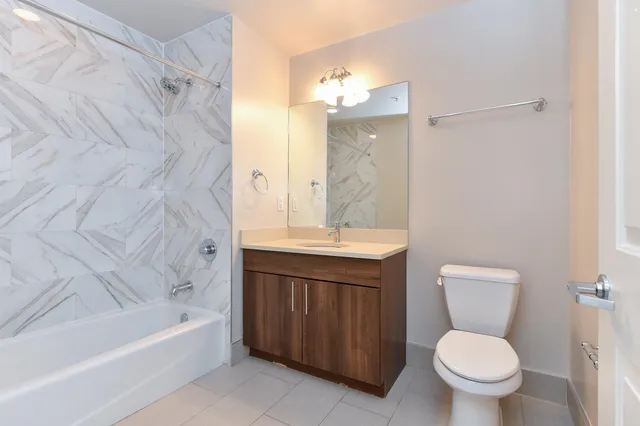 a bathroom with a sink a toilet and a bathtub