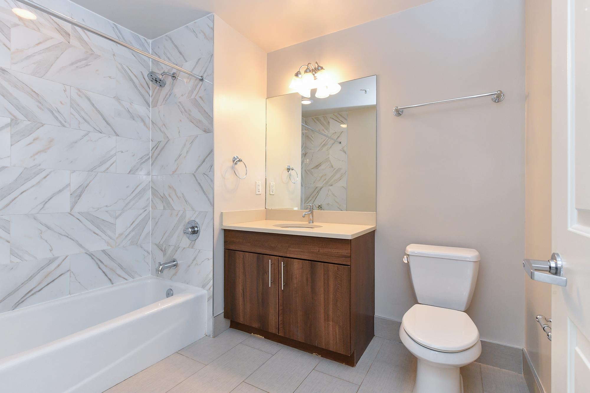 100 Marshall Street, Unit 608 Hoboken, NJ 07030 - Photo 13 of 22 a bathroom with a sink a toilet and a bathtub