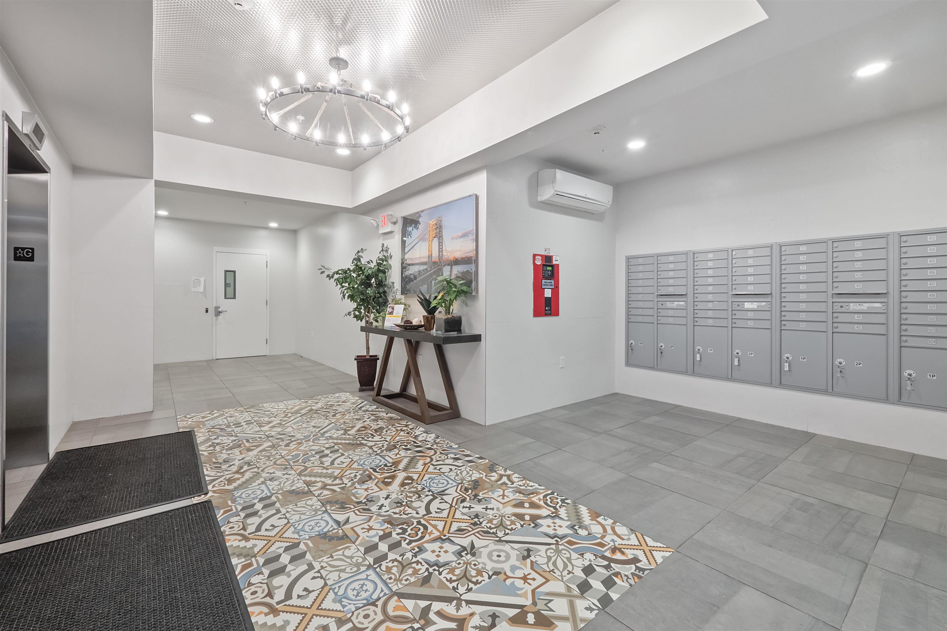 100 Marshall Street, Unit 608 Hoboken, NJ 07030 - Photo 21 of 22 a view of a hallway with a chandelier