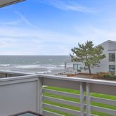 a view of a kitchen with a sink and microwave