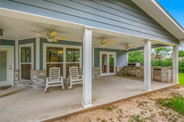 a view of a house with porch and furniture
