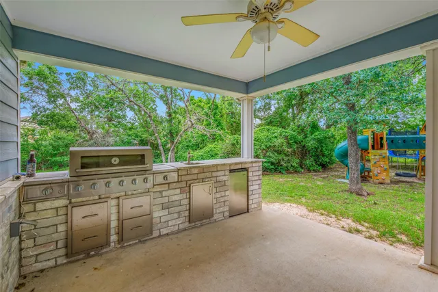 a view of a porch with furniture and garden