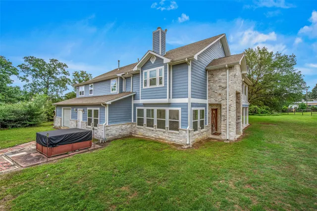 a view of a park with plants and wooden fence