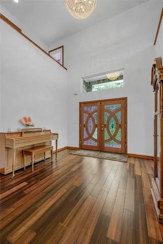 a view of room with furniture and wooden floor
