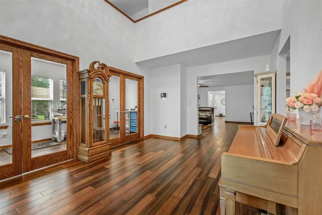 a living room with fireplace furniture and a table