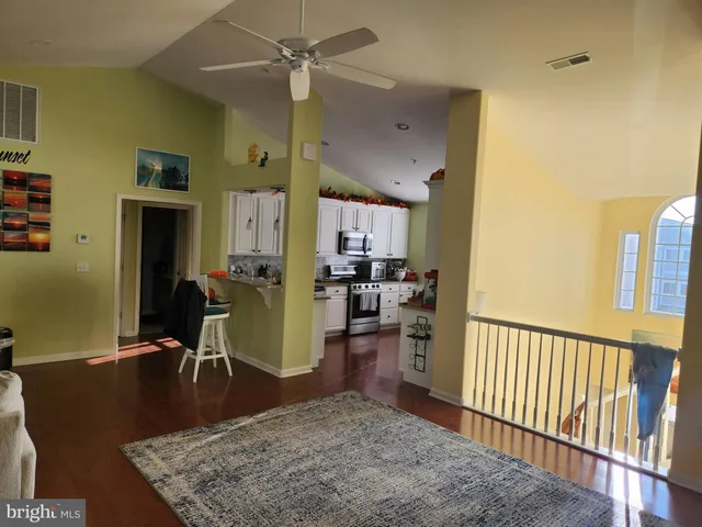 a view of a living room and a dining table