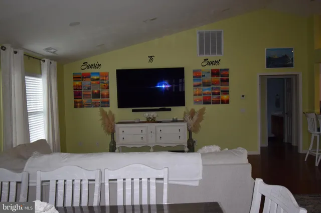 a bedroom with furniture and flat screen tv