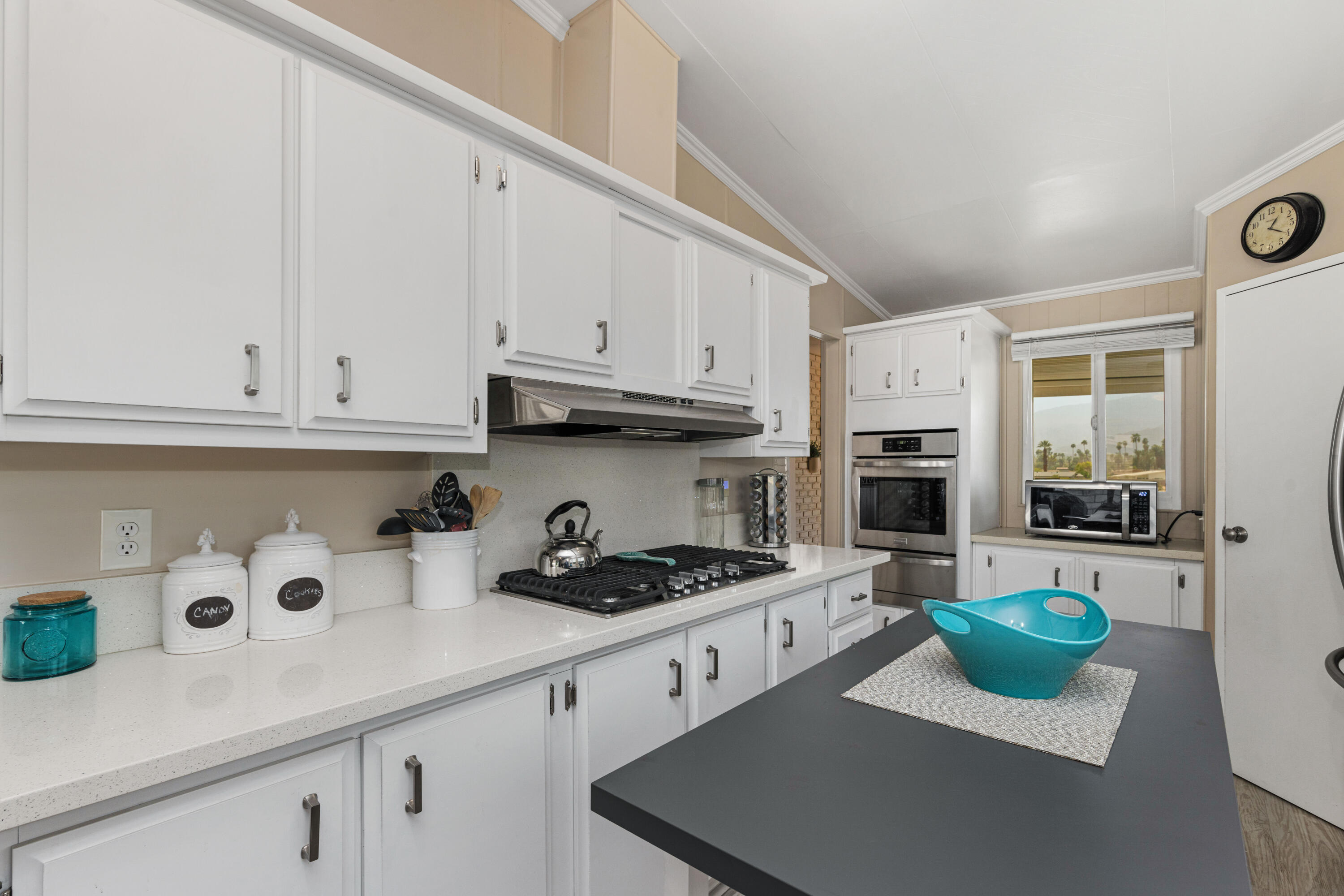 Undisclosed Address Palm Desert, CA 92260 - Photo 11 of 41 a kitchen with stainless steel appliances granite countertop a sink and a stove