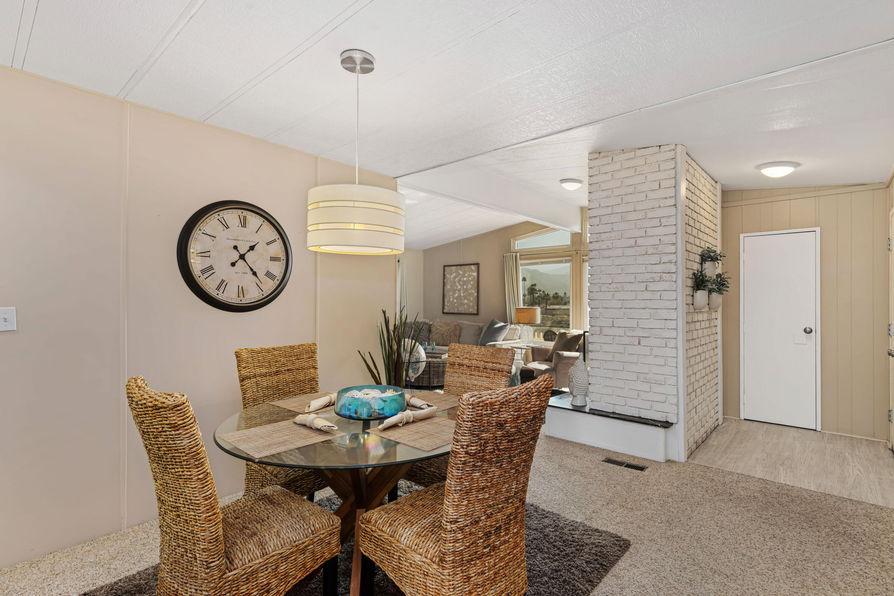 Undisclosed Address Palm Desert, CA 92260 - Photo 13 of 41 a view of a dining room with furniture and a clock