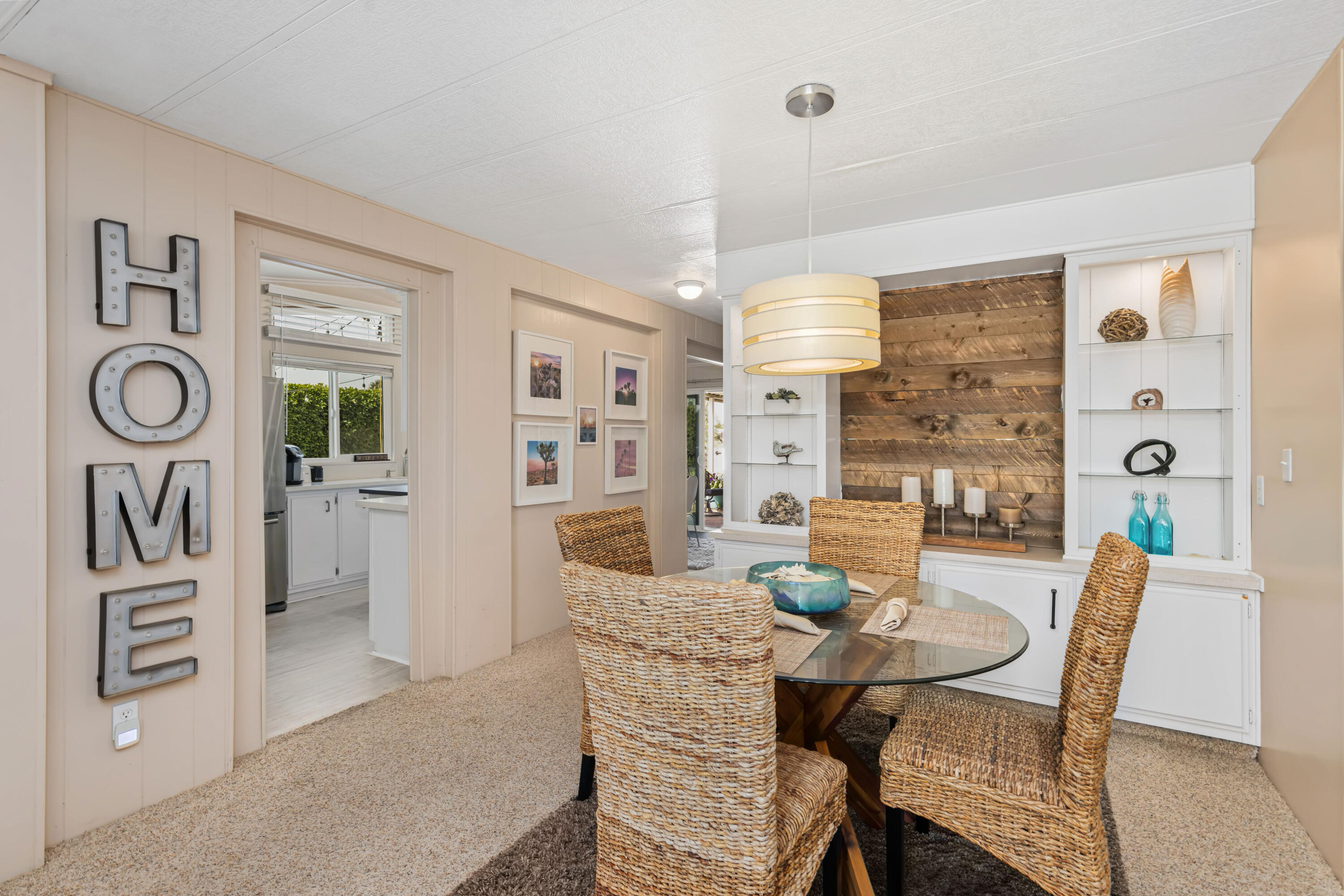 Undisclosed Address Palm Desert, CA 92260 - Photo 14 of 41 a view of a dining room with furniture window and wooden floor