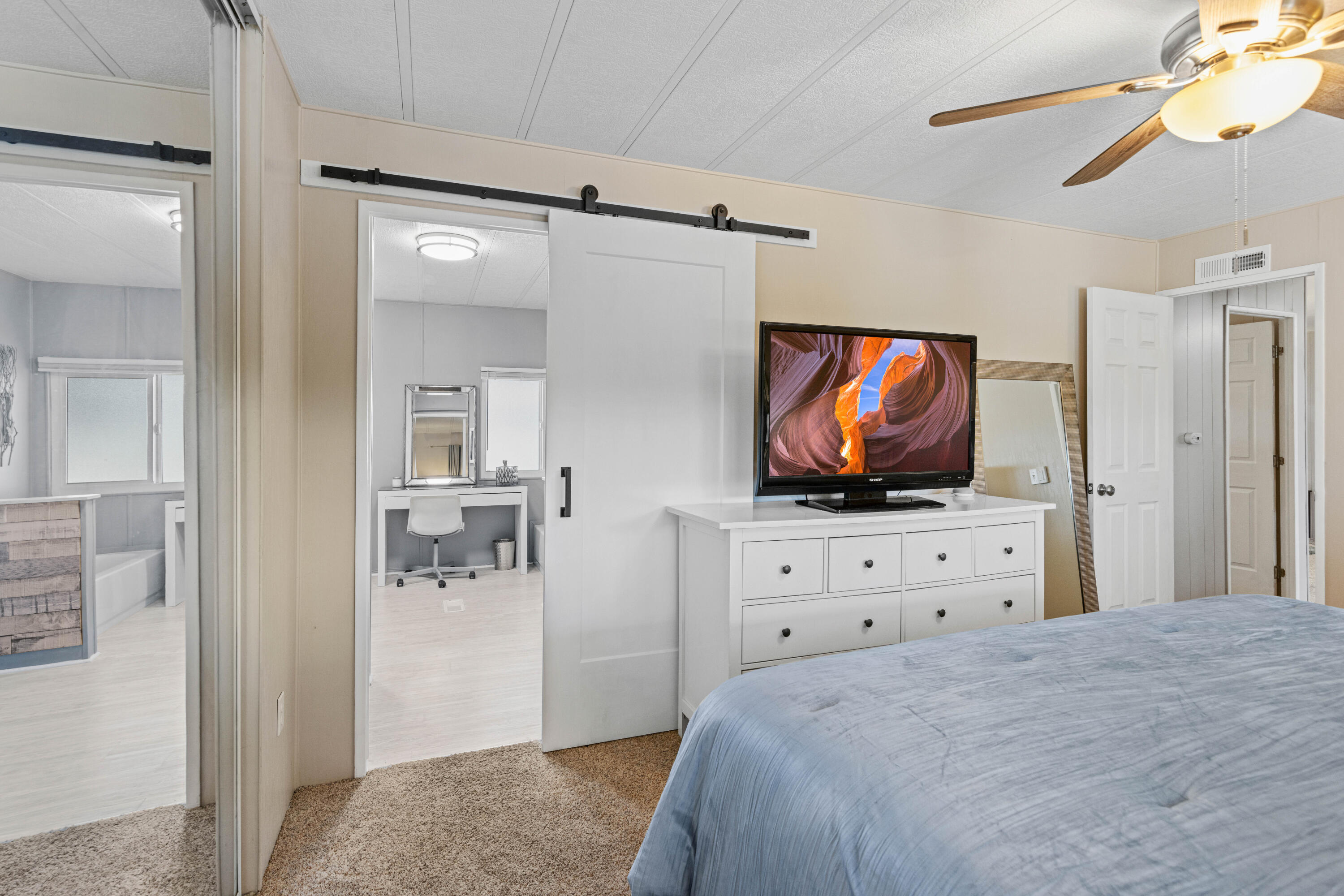 Undisclosed Address Palm Desert, CA 92260 - Photo 18 of 41 a bedroom with furniture and a flat screen tv