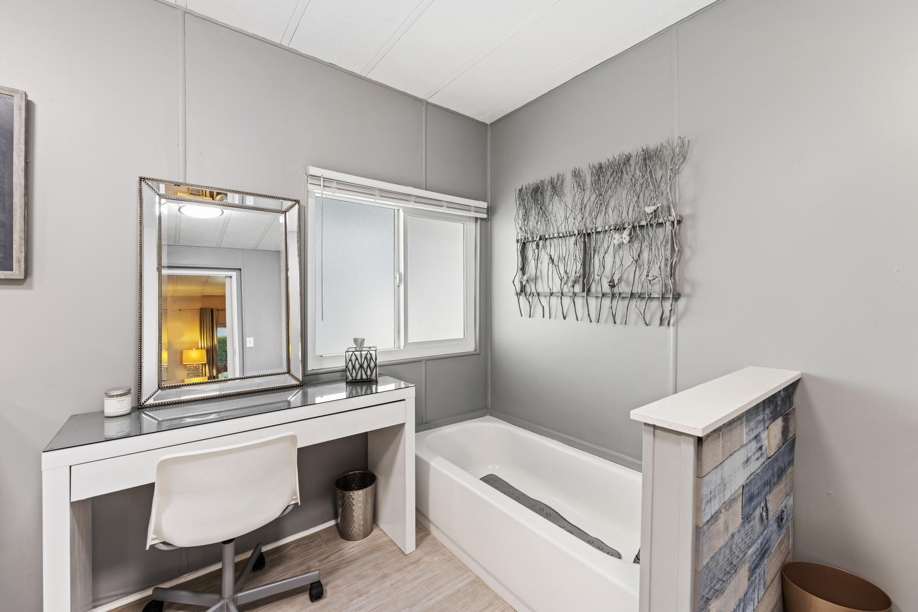 Undisclosed Address Palm Desert, CA 92260 - Photo 23 of 41 a en suite bathroom with a double vanity sink a mirror and a bathtub