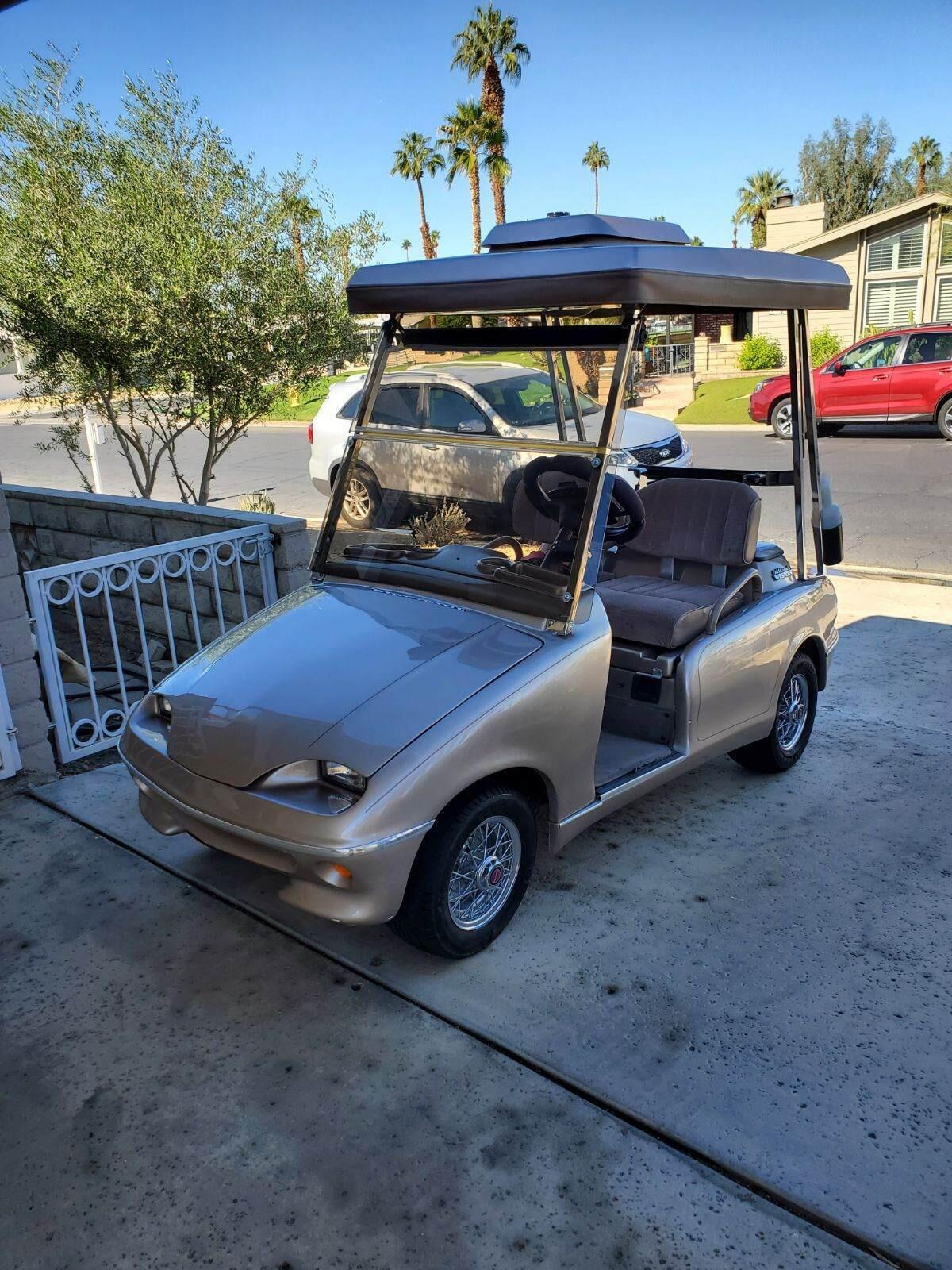 Undisclosed Address Palm Desert, CA 92260 - Photo 34 of 41 a front view of a house with parking area