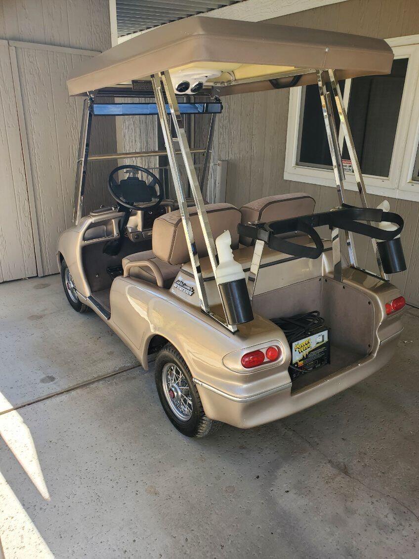 Undisclosed Address Palm Desert, CA 92260 - Photo 36 of 41 a car and bike parked in a garage
