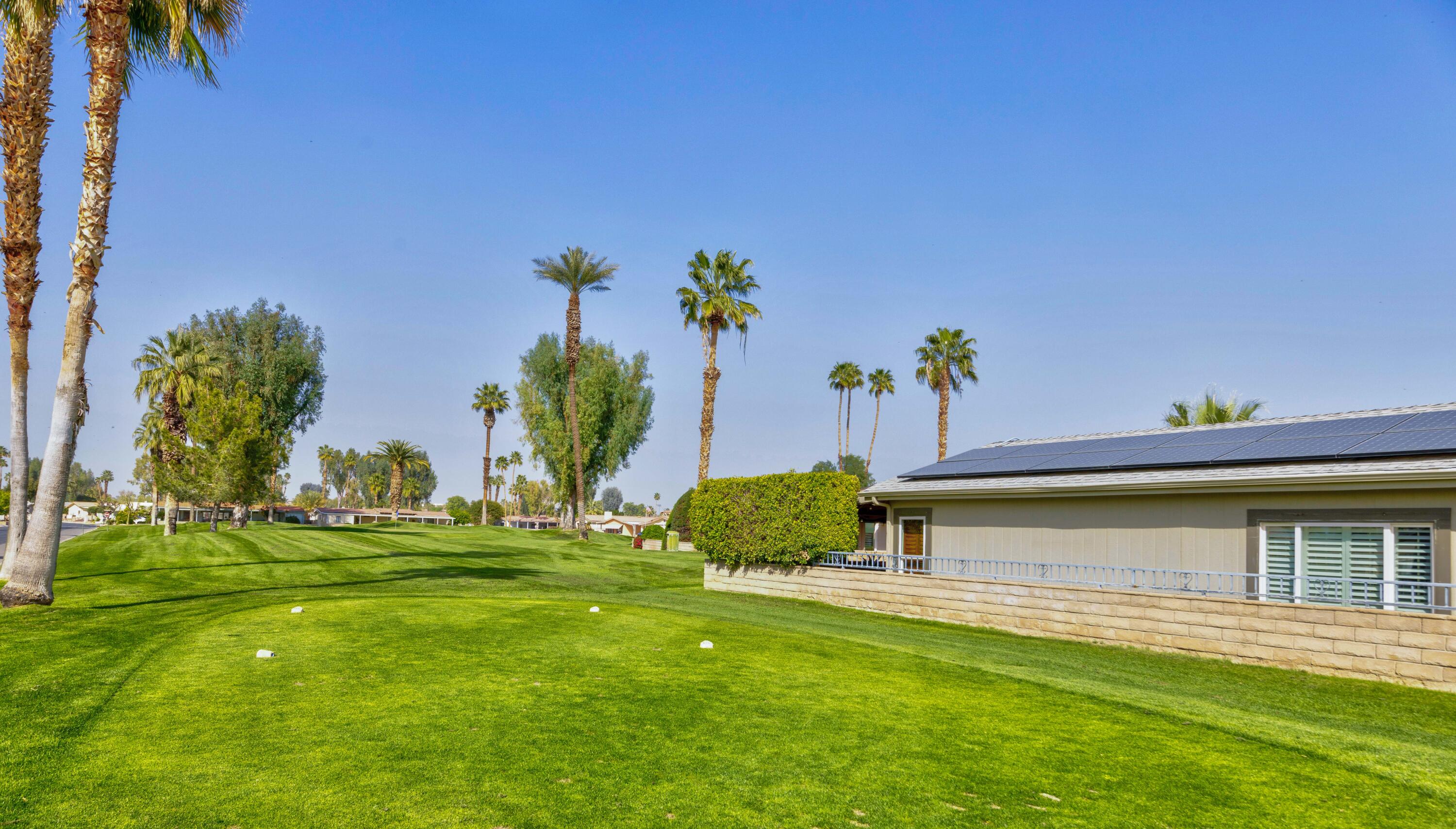 Undisclosed Address Palm Desert, CA 92260 - Photo 37 of 41 a swimming pool with outdoor seating and yard