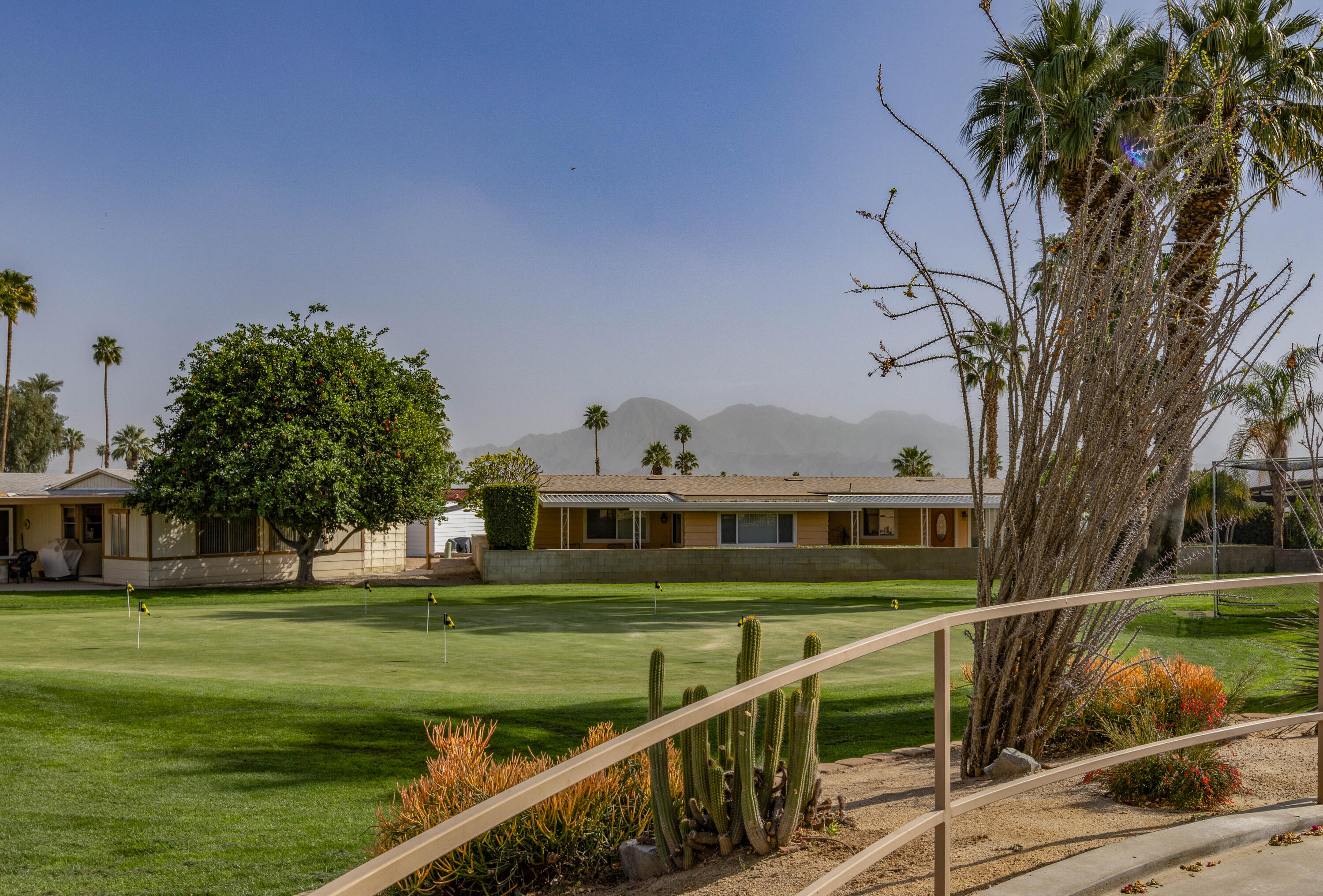 Undisclosed Address Palm Desert, CA 92260 - Photo 38 of 41 a view of a house with a yard