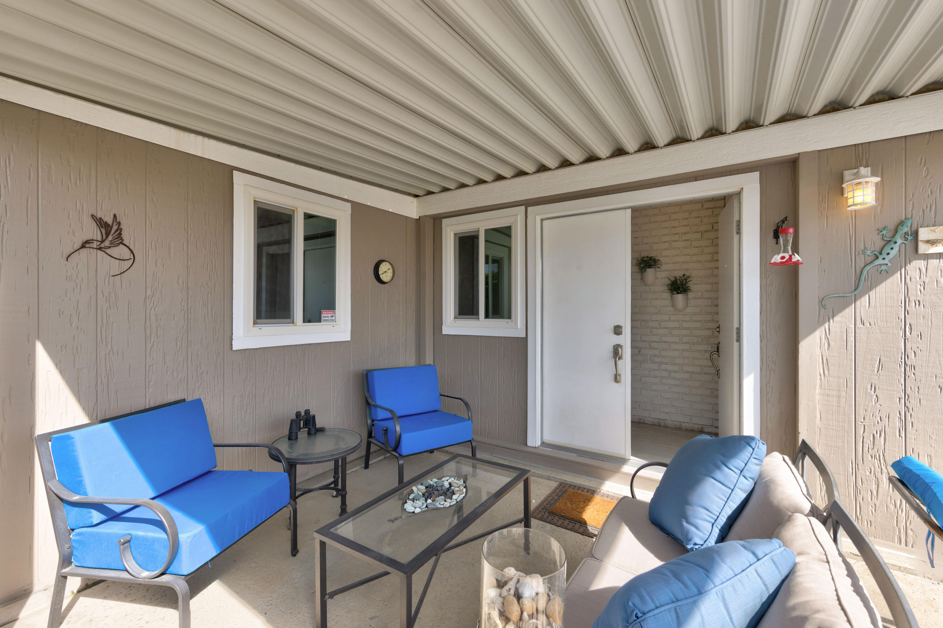 Undisclosed Address Palm Desert, CA 92260 - Photo 4 of 41 a living room with furniture and a wooden floor