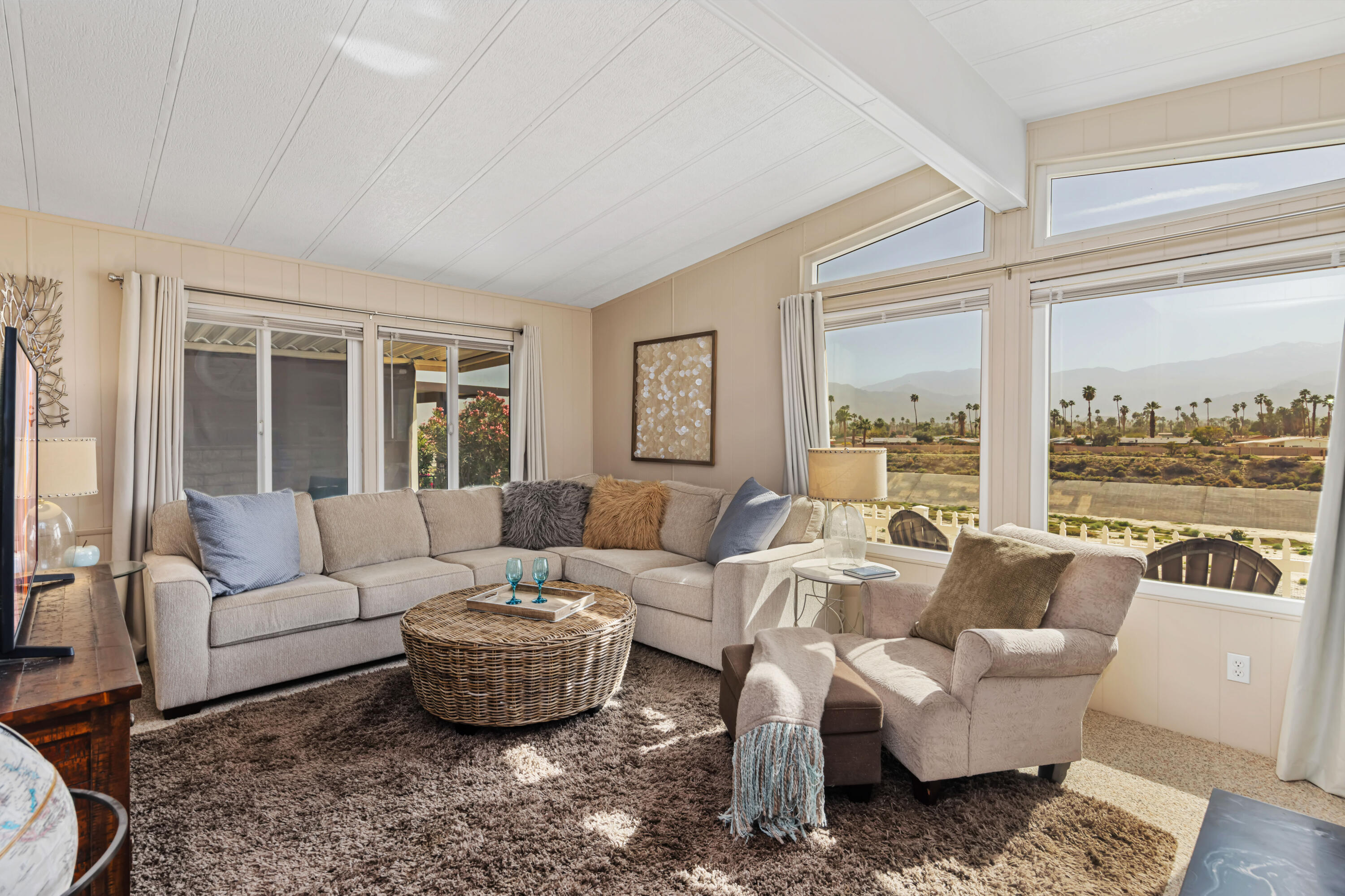 Undisclosed Address Palm Desert, CA 92260 - Photo 6 of 41 a living room with furniture and a large window