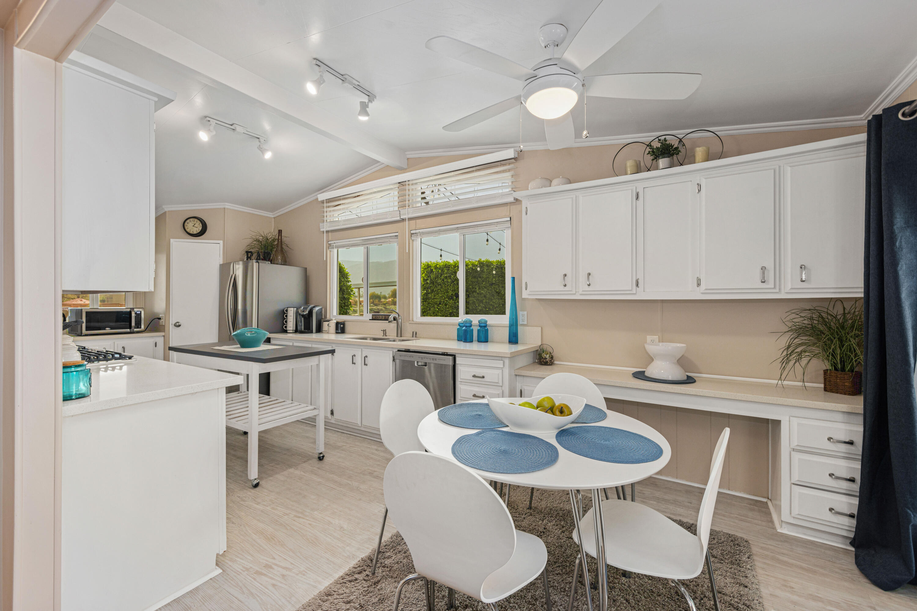 Undisclosed Address Palm Desert, CA 92260 - Photo 9 of 41 a kitchen that has a table and chairs in it